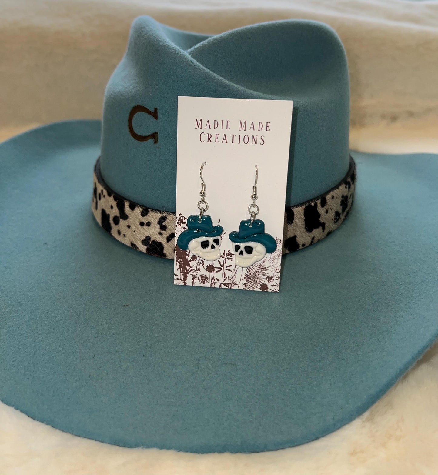 Cowboy skull dangle earrings