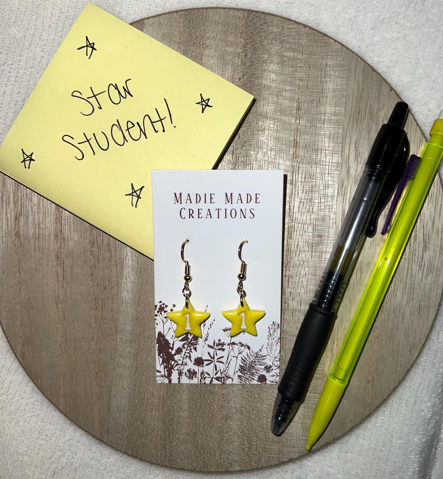 Star student dangle earrings