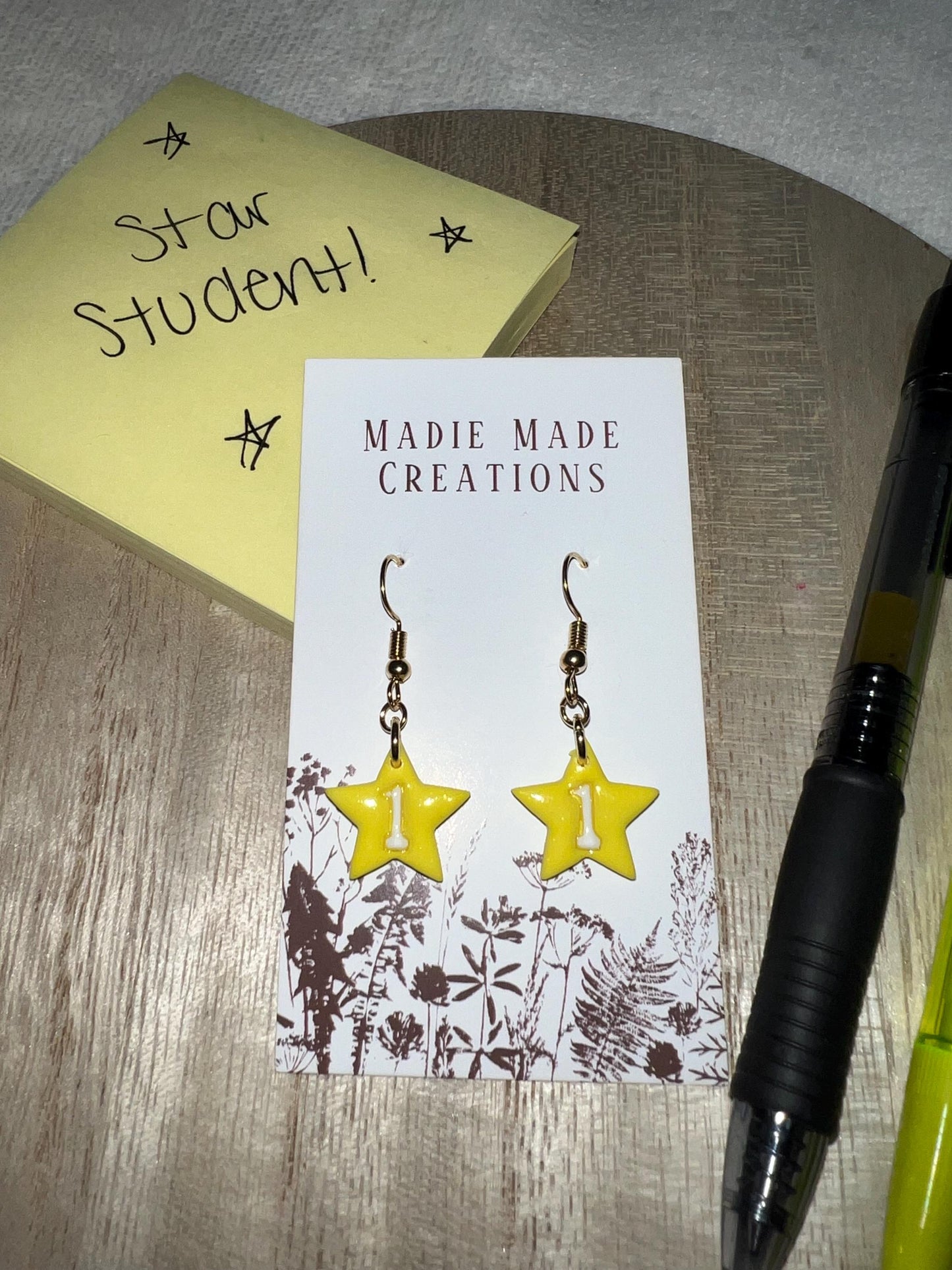 Star student dangle earrings
