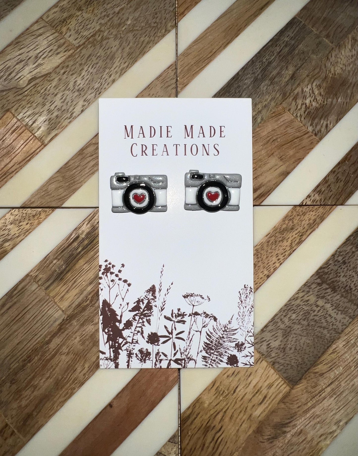 Camera stud earrings