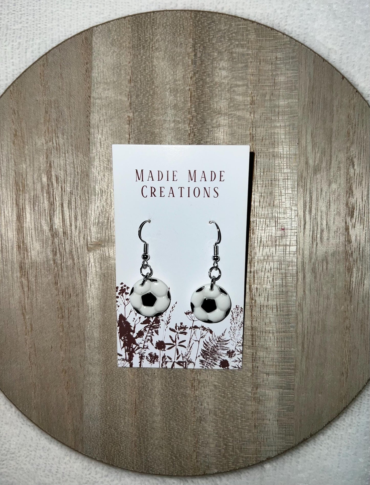 Sports themed dangle earrings