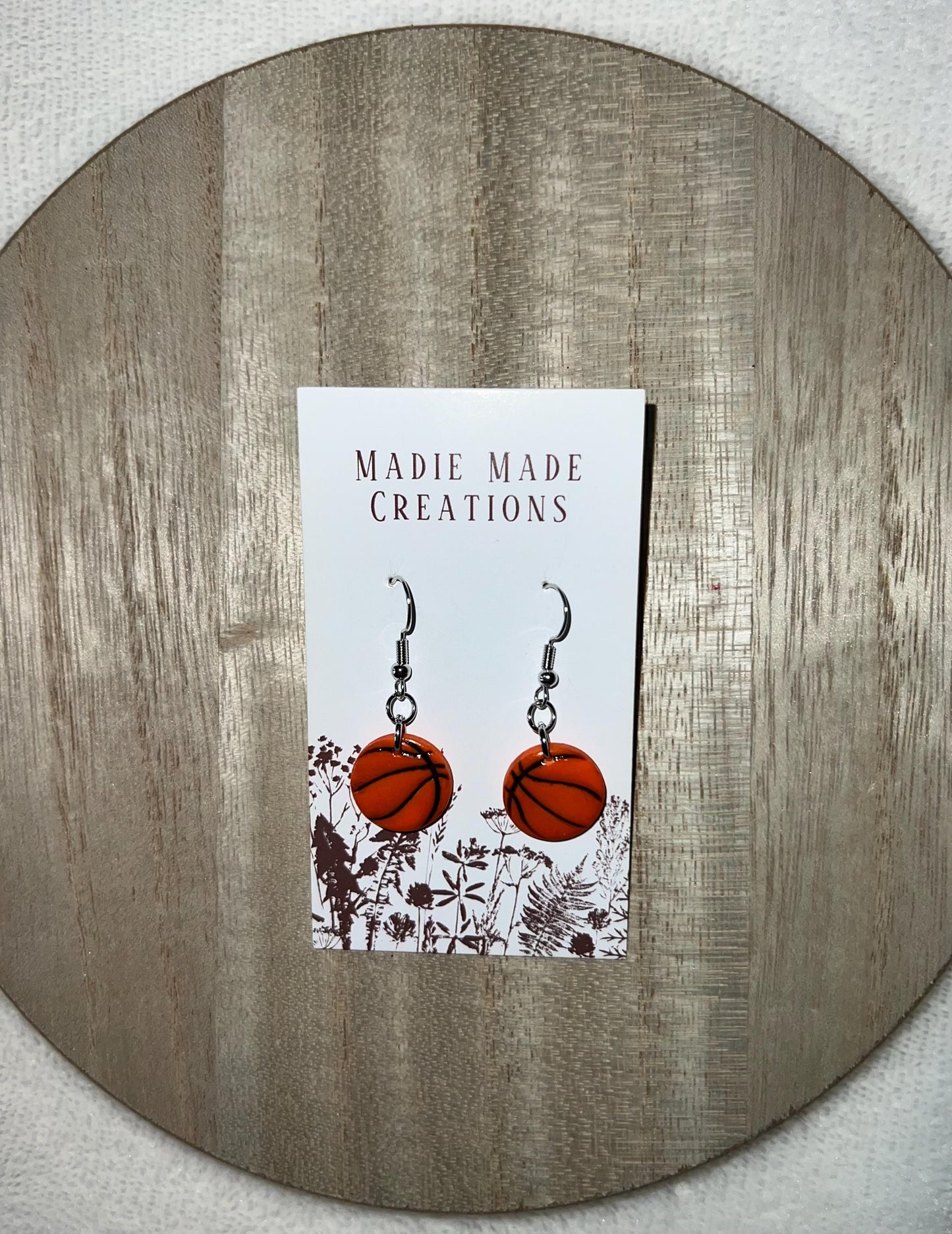 Sports themed dangle earrings